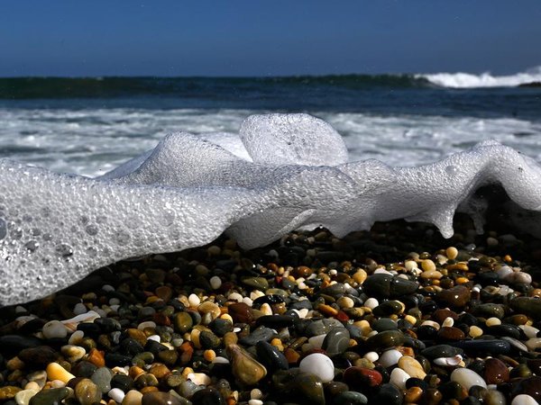 Waves washing across pebbles (file image)