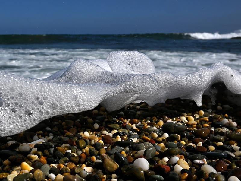 Waves washing across pebbles (file image)